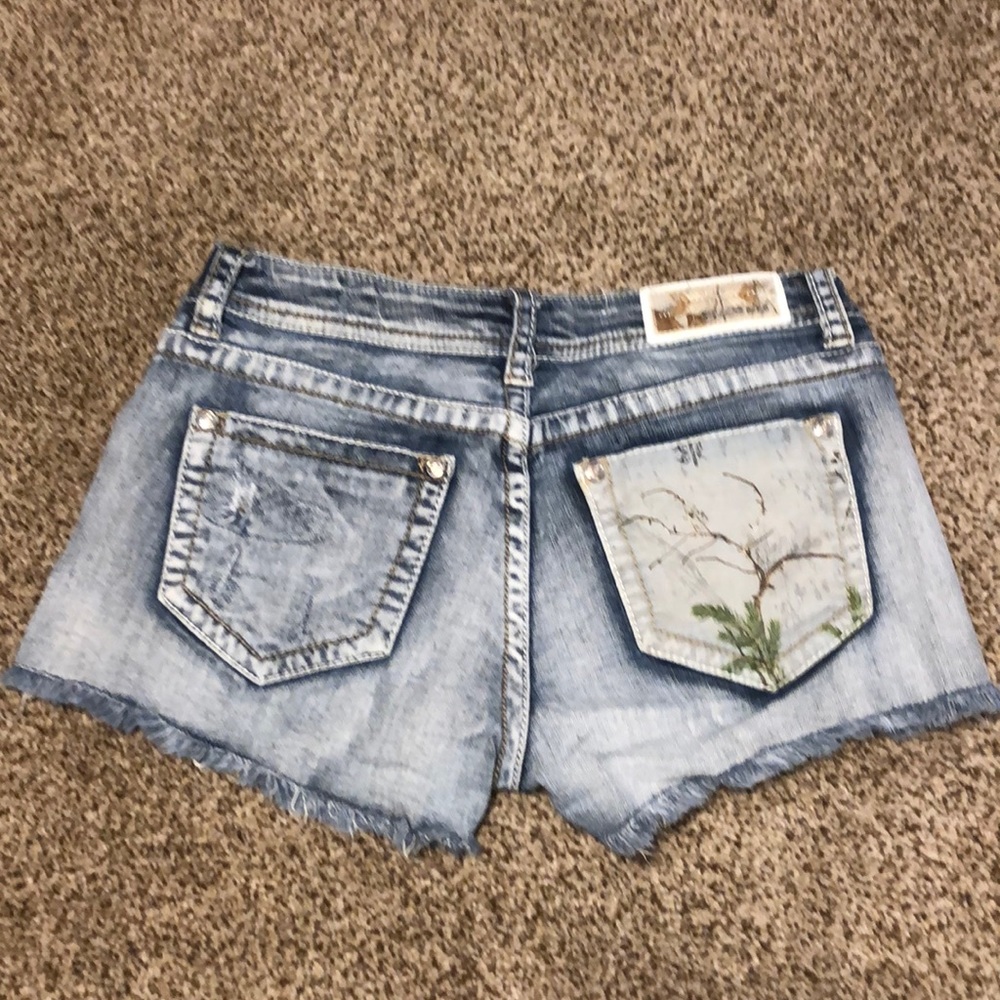 Grace in LA shorts with Realtree camo design